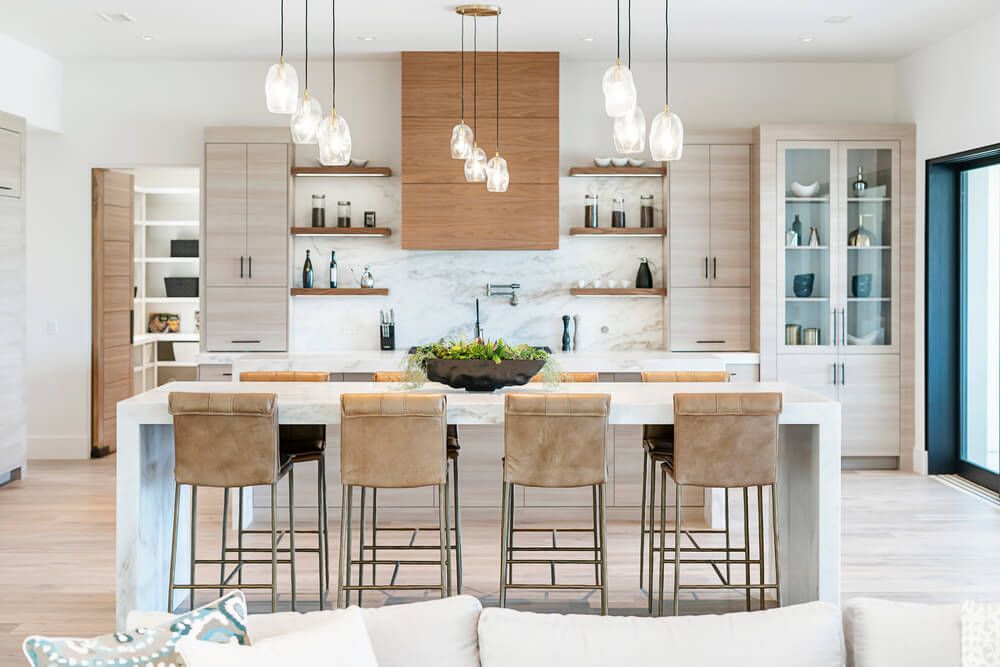 Modern kitchen with clean white cabinets, pendant lighting, and contemporary finishes